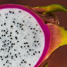 Load image into Gallery viewer, Dragon Fruit, Papaya & Carrot Soap with vibrant dragon fruit slice showcasing its bright pink skin and white flesh.