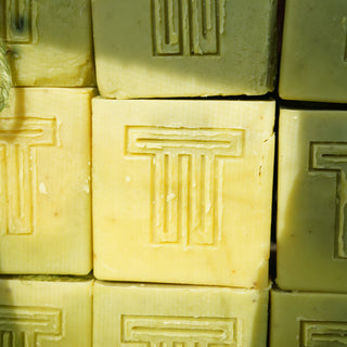 Close-up of gold bars with a geometric pattern