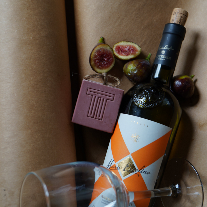 pink soap with figs wine bottle wine glass