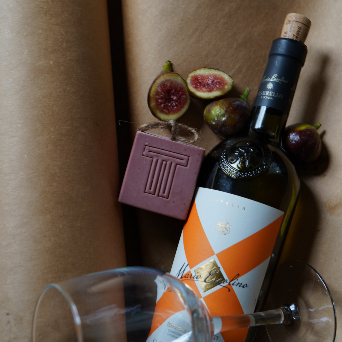 pink soap with figs wine bottle wine glass